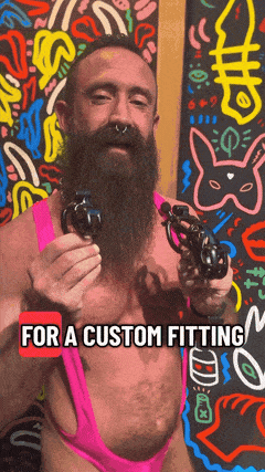 A man holds two KINK3D chastity cages for a custom fitting, from Clonezone's Locktober campaign