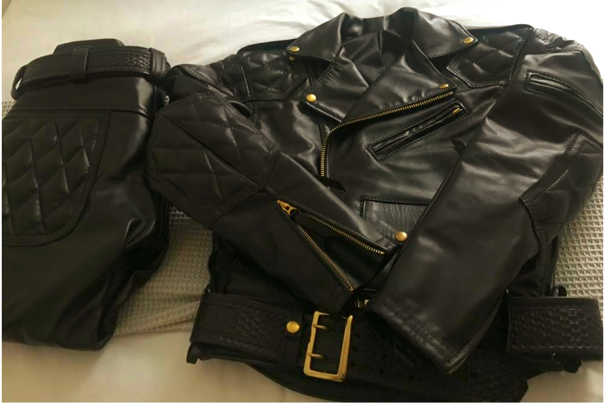 Fetish Week London packing flat-lay: harness, jock, sports kit, latex, lube and accessories from Clonezone